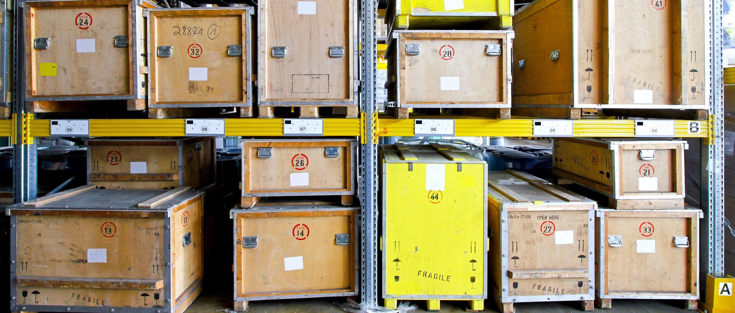 Wooden crates on shelves in warehouse